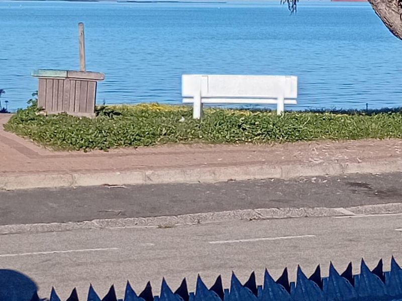 A scenic view of the coastline and ocean, showcasing the property's proximity to the water.