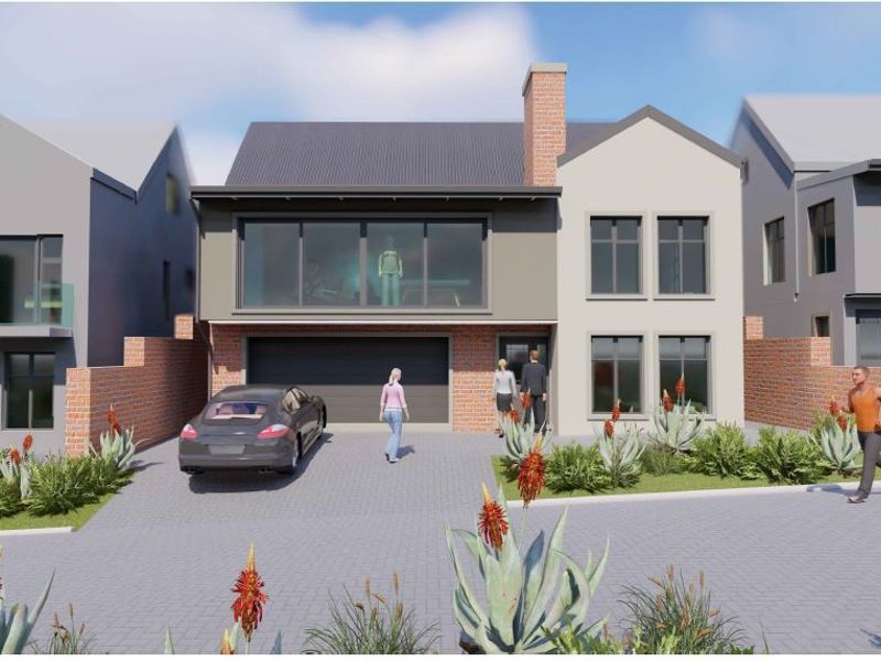 A modern two-story residential facade featuring a double garage, brick chimney, and paved driveway in a contemporary estate setting.