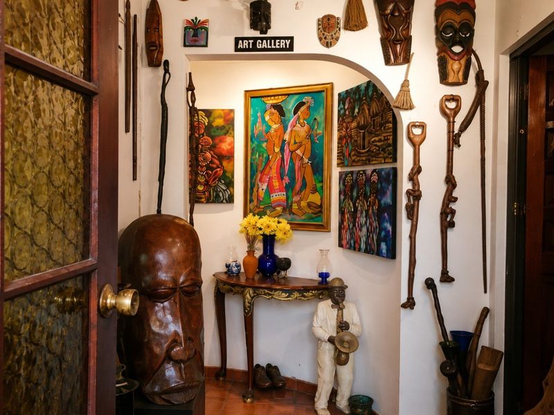An entryway featuring terracotta floor tiles and an arched transition leading into the home interior.