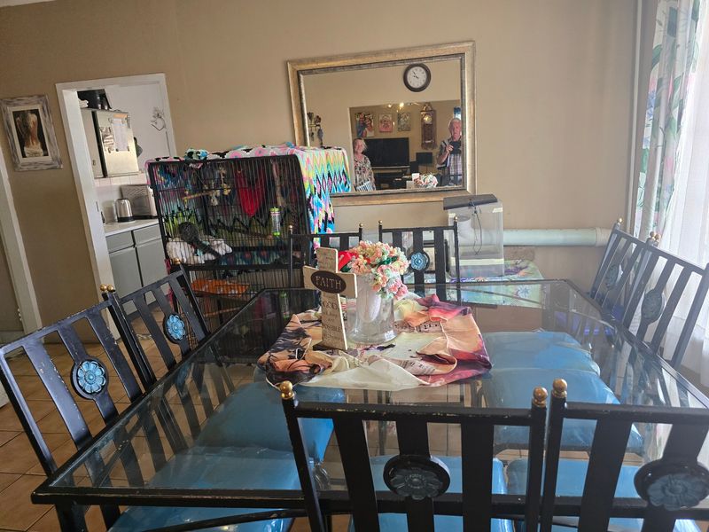 Dining area featuring tiled flooring with an open-plan layout connecting to the kitchen space.