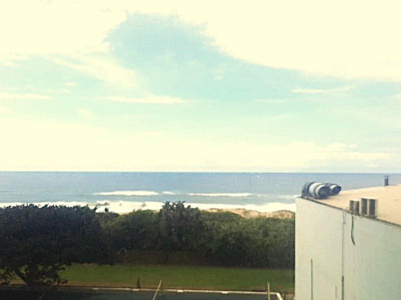 A scenic view of the ocean and coastline captured from an elevated position.