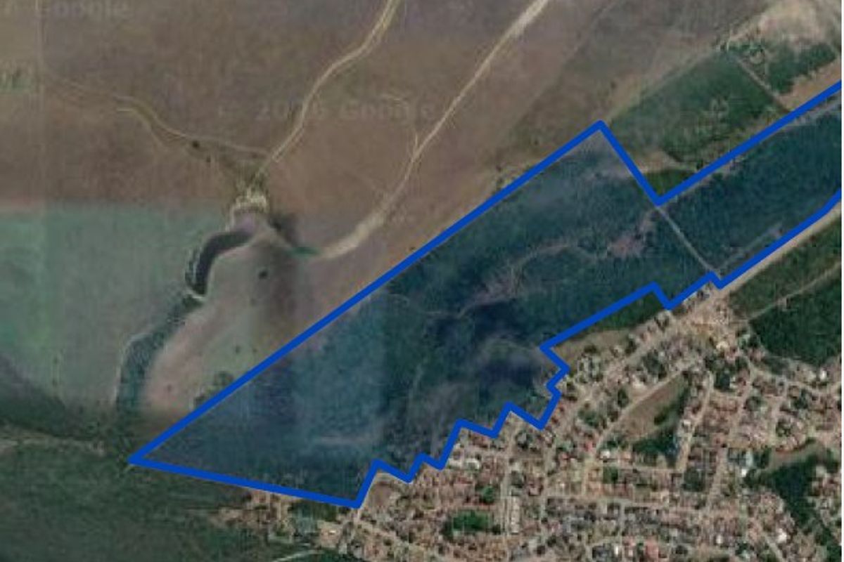 An aerial view showing the boundaries of the vacant residential land parcel adjacent to an existing residential area.