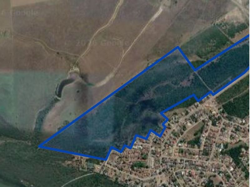 An aerial view showing the boundaries of the vacant residential land parcel adjacent to an existing residential area.