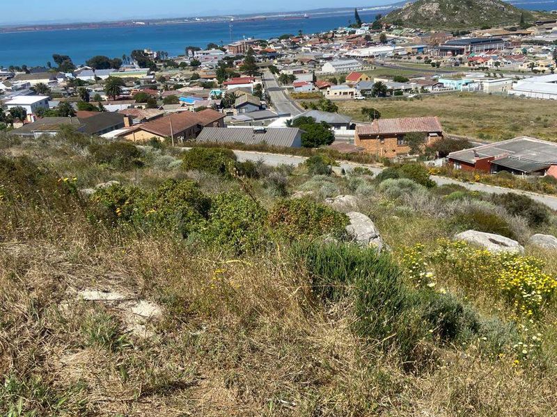 Elevated panoramic view overlooking the coastal town, surrounding landscape, and ocean horizon from the vacant residential land.