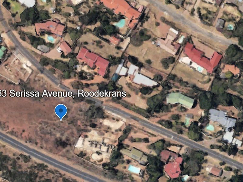 Aerial view of the vacant residential land located at 63 Serissa Avenue, Roodekrans, showing the surrounding neighborhood and street access.