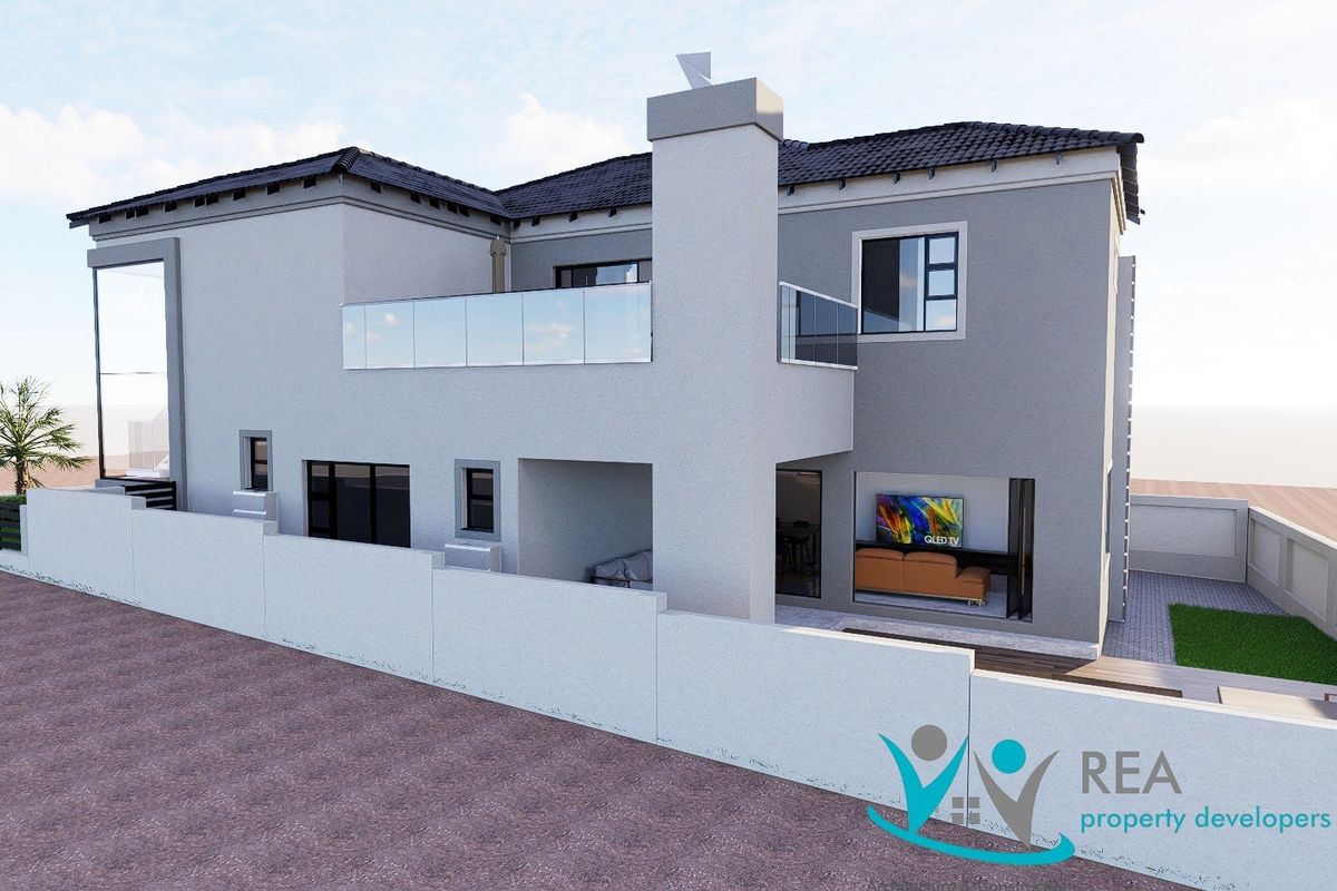 A modern double-storey residential property featuring a rear balcony with glass balustrades, a prominent chimney, and a secure boundary wall.
