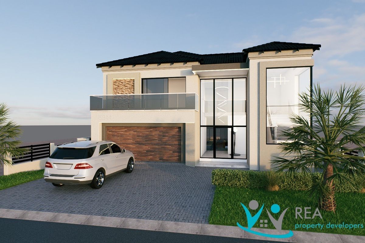 Modern double-story residential facade featuring a paved driveway, double garage, and a prominent glass-fronted entrance with a balcony.