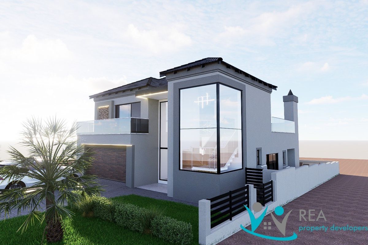 Modern double-story residential facade featuring a glass corner window, balcony with glass balustrade, and integrated double garage.