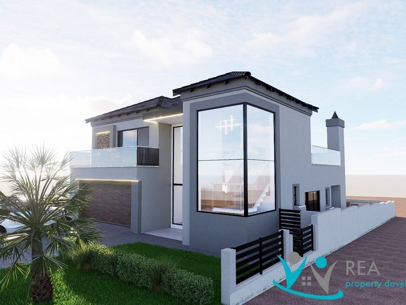 Modern double-story residential facade featuring a glass corner window, balcony with glass balustrade, and integrated double garage.