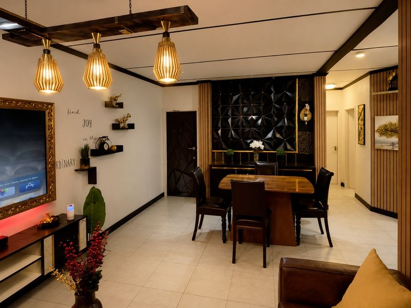 Modern open-plan living and dining area featuring tiled floors, decorative wall paneling, and stylish pendant lighting, creating a sophisticated and well-maintained interior space.