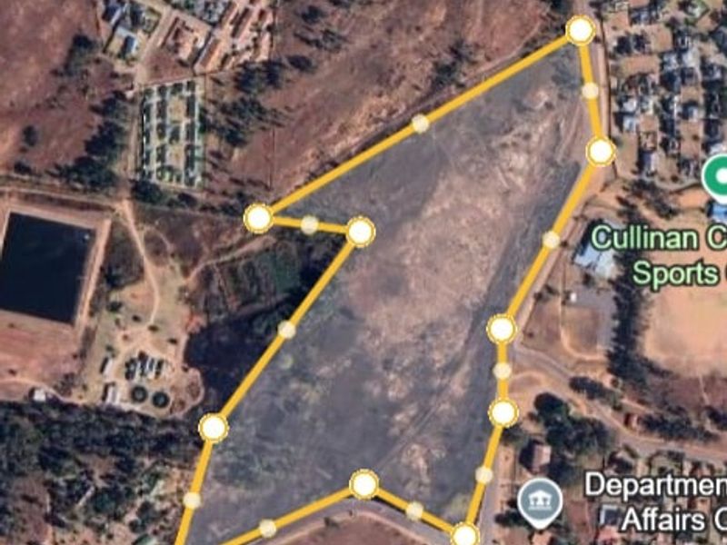 Aerial view of a large undeveloped land parcel in Cullinan, showing property boundaries and surrounding infrastructure.