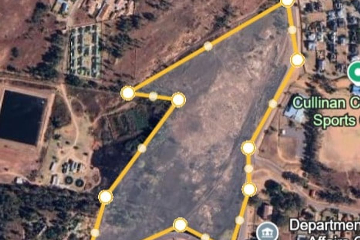 Aerial view of a large undeveloped land parcel in Cullinan, showing property boundaries and surrounding infrastructure.
