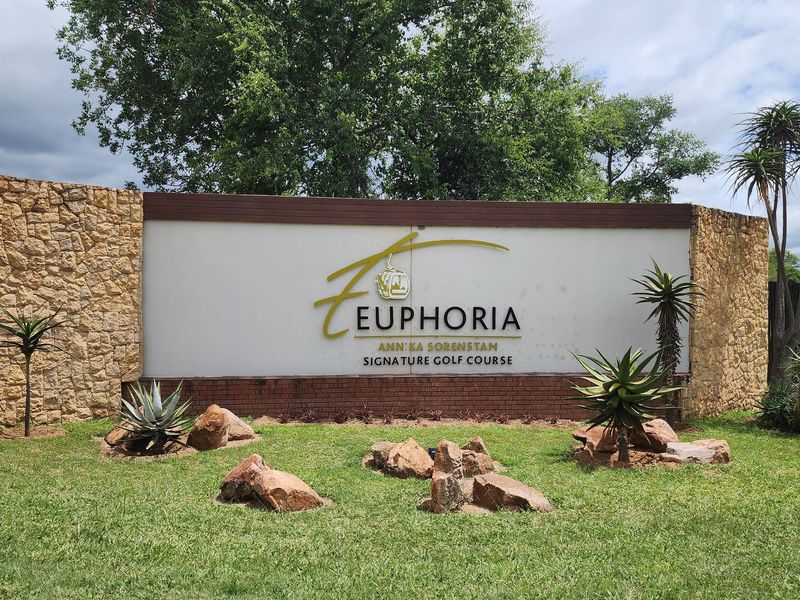 The entrance signage for Euphoria Annika Sorenstam Signature Golf Course, featuring stone cladding and well-maintained landscaping.