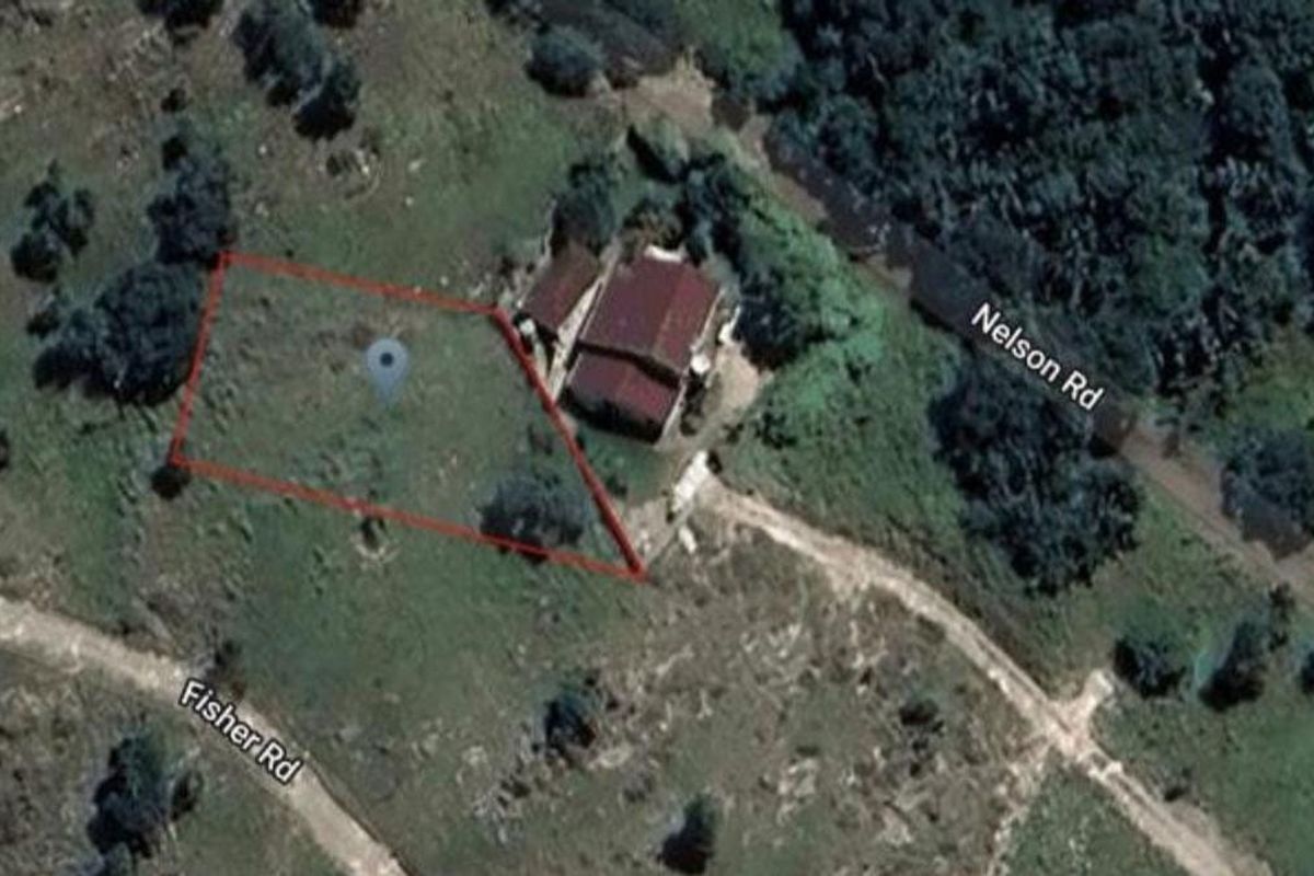 An aerial view of a vacant residential plot situated at the intersection of Nelson Road and Fisher Road.