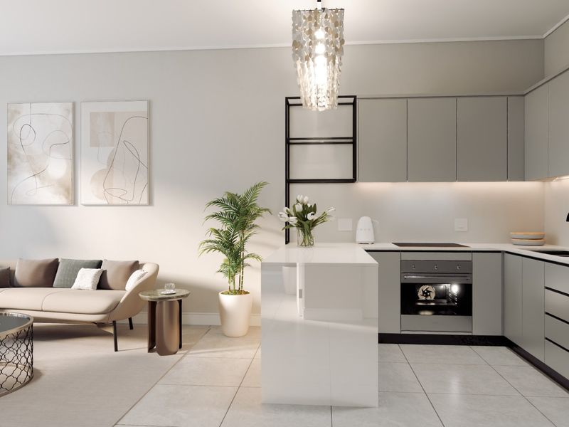 Modern open-plan living area featuring a sleek kitchen with integrated appliances, a central island, and neutral tiled flooring throughout.