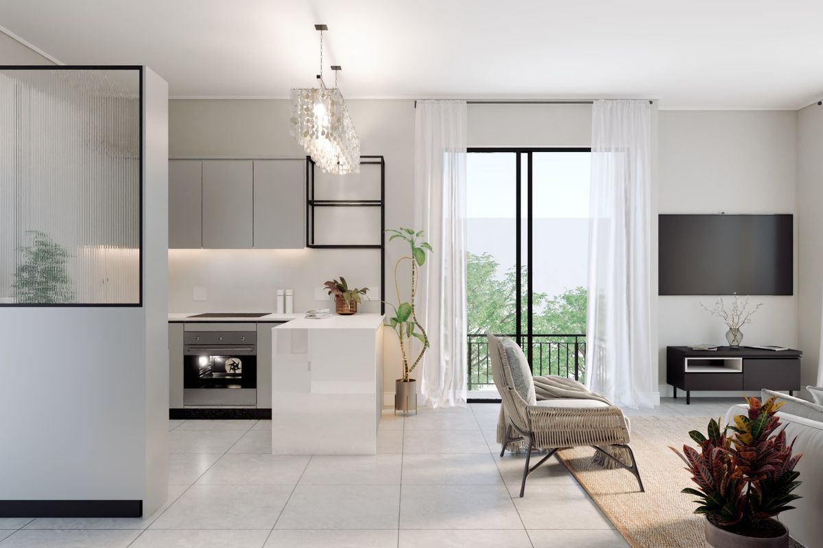 Modern open-plan living area featuring a sleek kitchen with built-in appliances, a central island, and a stylish fluted glass room divider.