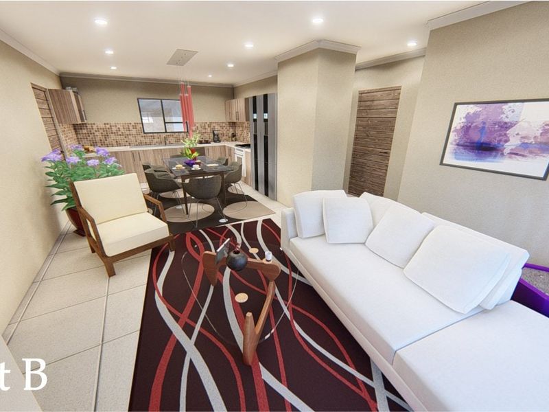 An open-plan living and kitchen area featuring tiled floors, recessed lighting, and a modern kitchen layout with mosaic backsplash.