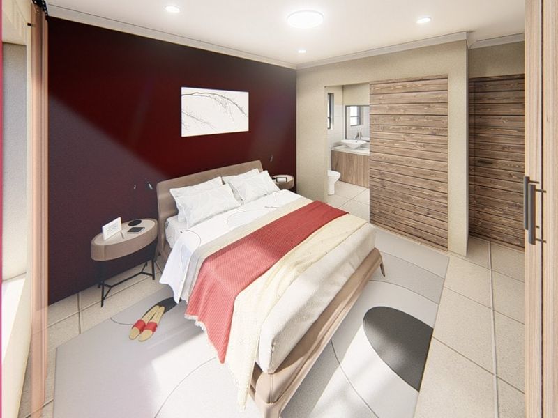 A modern bedroom featuring recessed lighting, tiled floors, and an integrated en-suite bathroom with a sliding door entry.