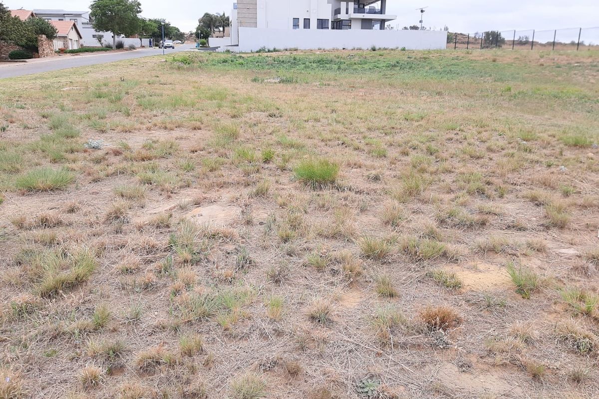 A vacant residential plot of land situated in a developed neighborhood, offering a clear site for future construction.