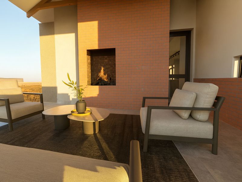 A covered patio featuring a built-in brick fireplace, tiled flooring, and expansive views of the surrounding landscape.