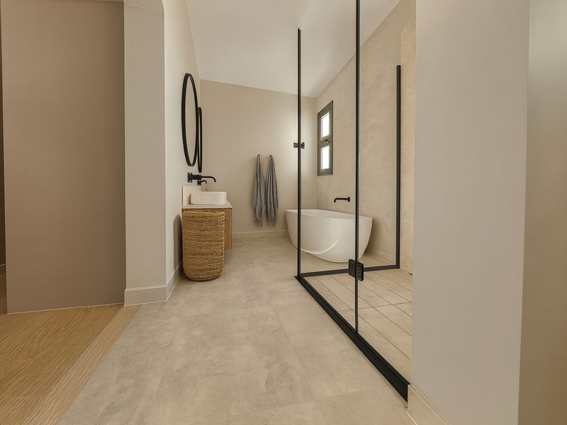Modern bathroom featuring a freestanding bathtub, a glass-enclosed walk-in shower, and a contemporary vanity with a vessel sink.
