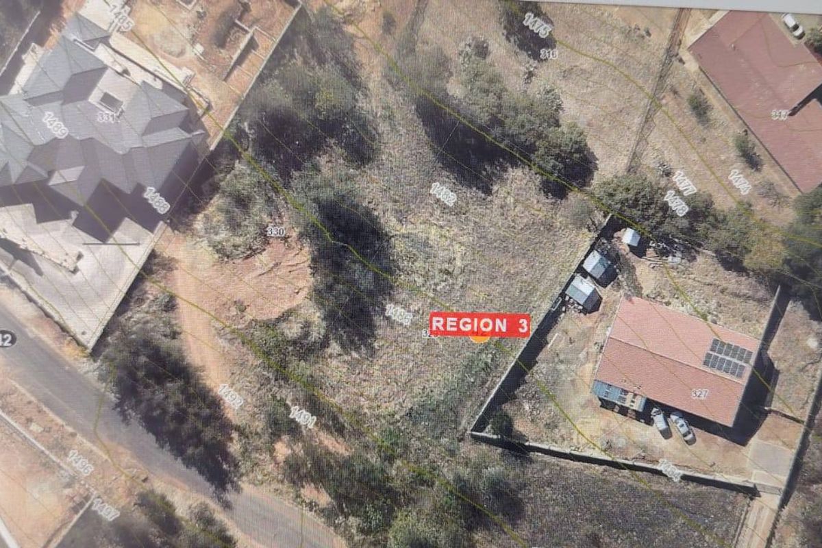 An aerial view of a vacant residential plot showing topographical contours, boundary lines, and surrounding properties.