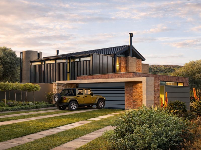 Modern architectural house featuring a striking combination of brick and dark metal cladding, with a paved driveway and well-maintained landscaped garden.