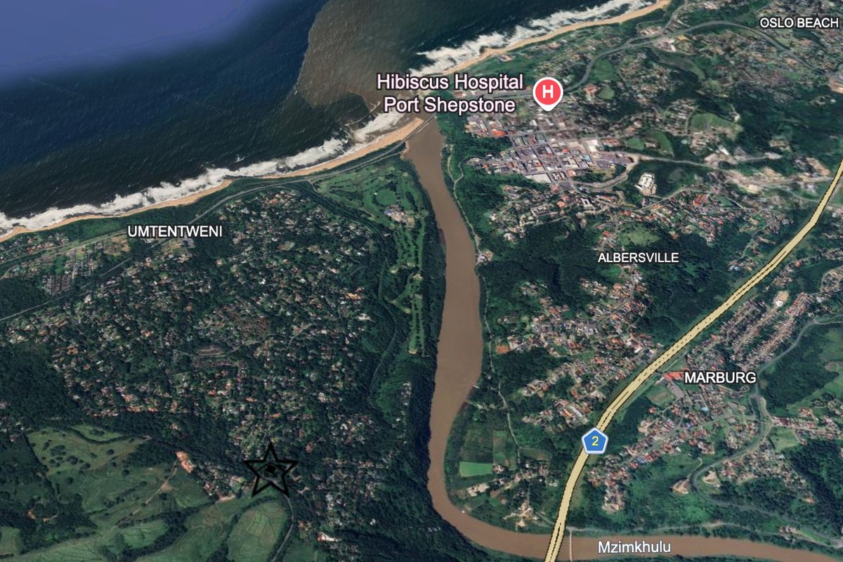 An aerial satellite view showing the regional landscape, river, and coastal proximity of the property location.