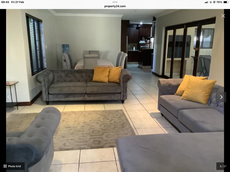 Open plan living and dining area featuring tiled floors, recessed lighting, and direct access to an outdoor patio through sliding glass doors.
