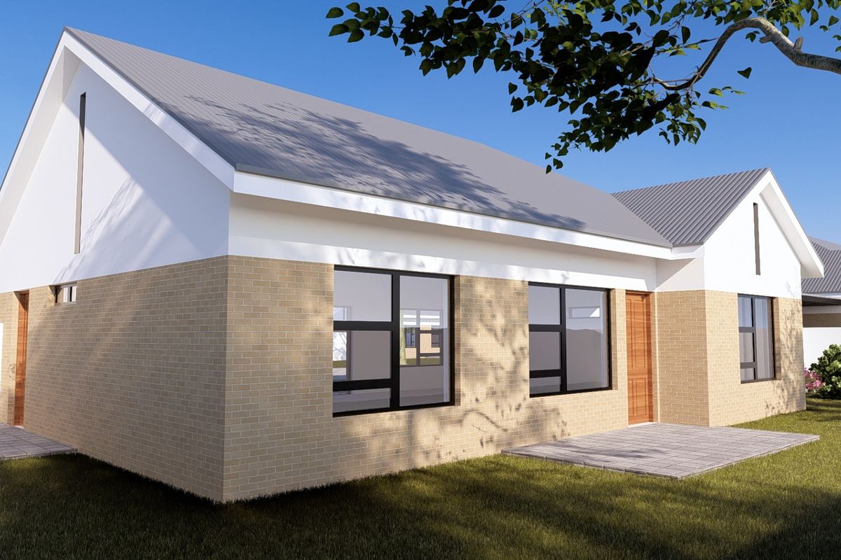 A modern townhouse exterior featuring a pitched metal roof, light brick facade, and paved patio area set within a landscaped garden.