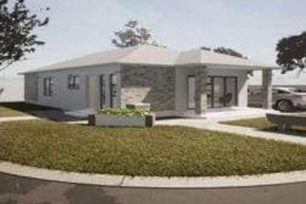 A modern single-story residential property featuring stone cladding, a covered patio entrance, and a well-maintained front lawn and driveway.