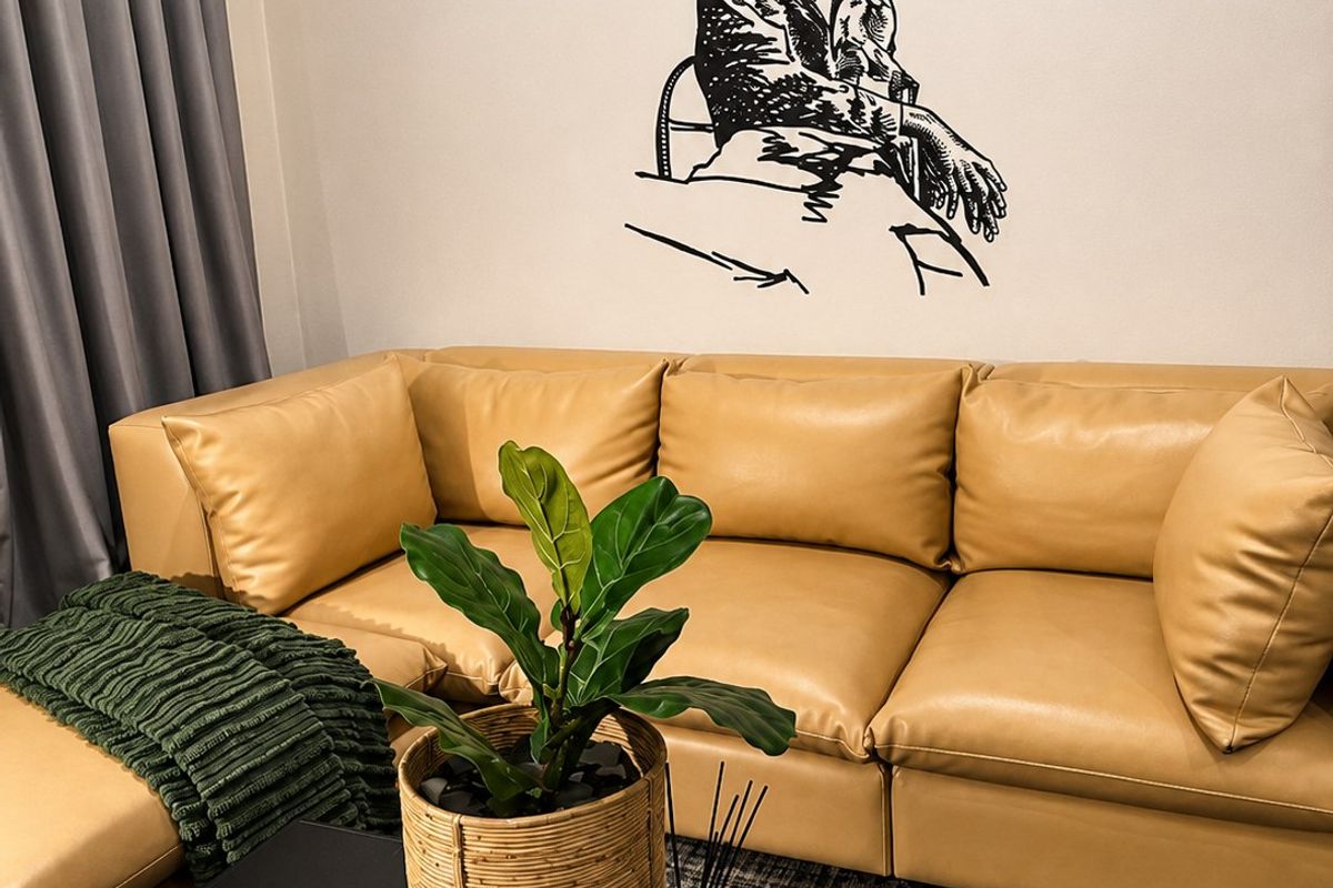 A well-maintained living room area featuring neutral wall finishes and integrated curtain tracks.