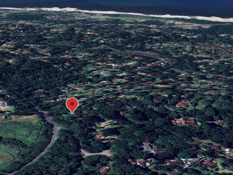 An aerial satellite view of a residential neighborhood with a map pin indicating the property location.