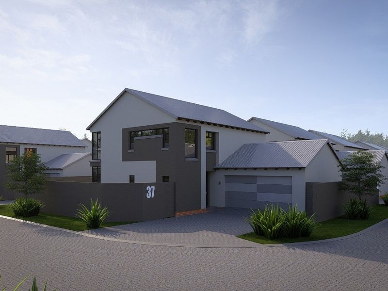 A modern residential house exterior featuring a paved driveway, attached garage, and contemporary architectural design within a suburban estate setting.