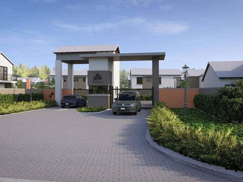 A modern gated entrance to Cedar Gate Villas, featuring a secure access control gate, brick boundary walls, and paved driveway.