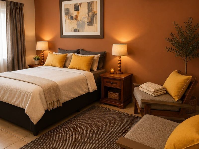 A well-maintained bedroom featuring tiled flooring, a wall-mounted air conditioning unit, and neutral wall tones.