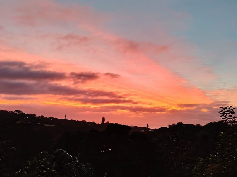 A scenic sunset view overlooking the surrounding landscape and horizon.