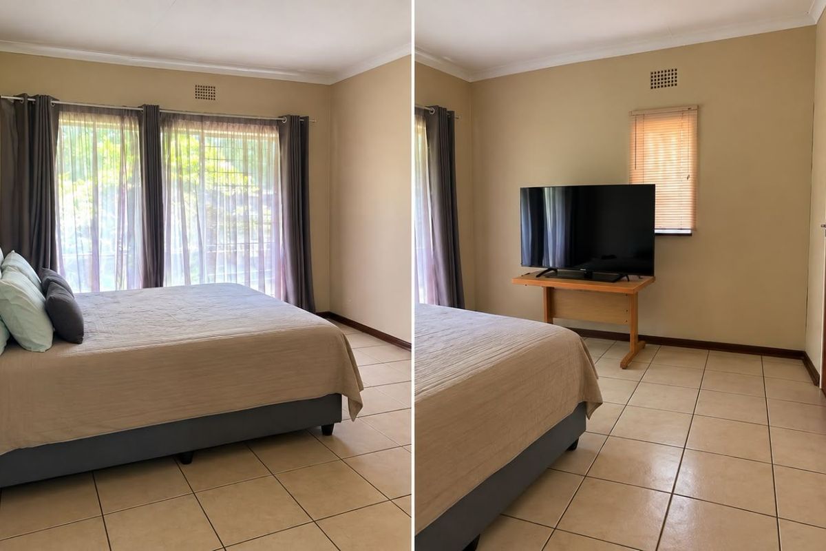 Spacious bedroom featuring neutral tiled flooring, large sliding glass doors for natural light, and a built-in air vent.