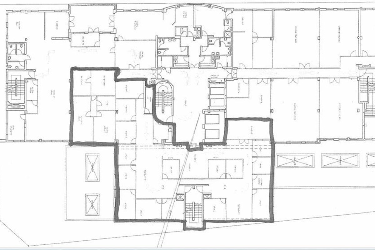 A detailed architectural floor plan illustrating the layout of the first floor, including various rooms, corridors, and stairwell access points.