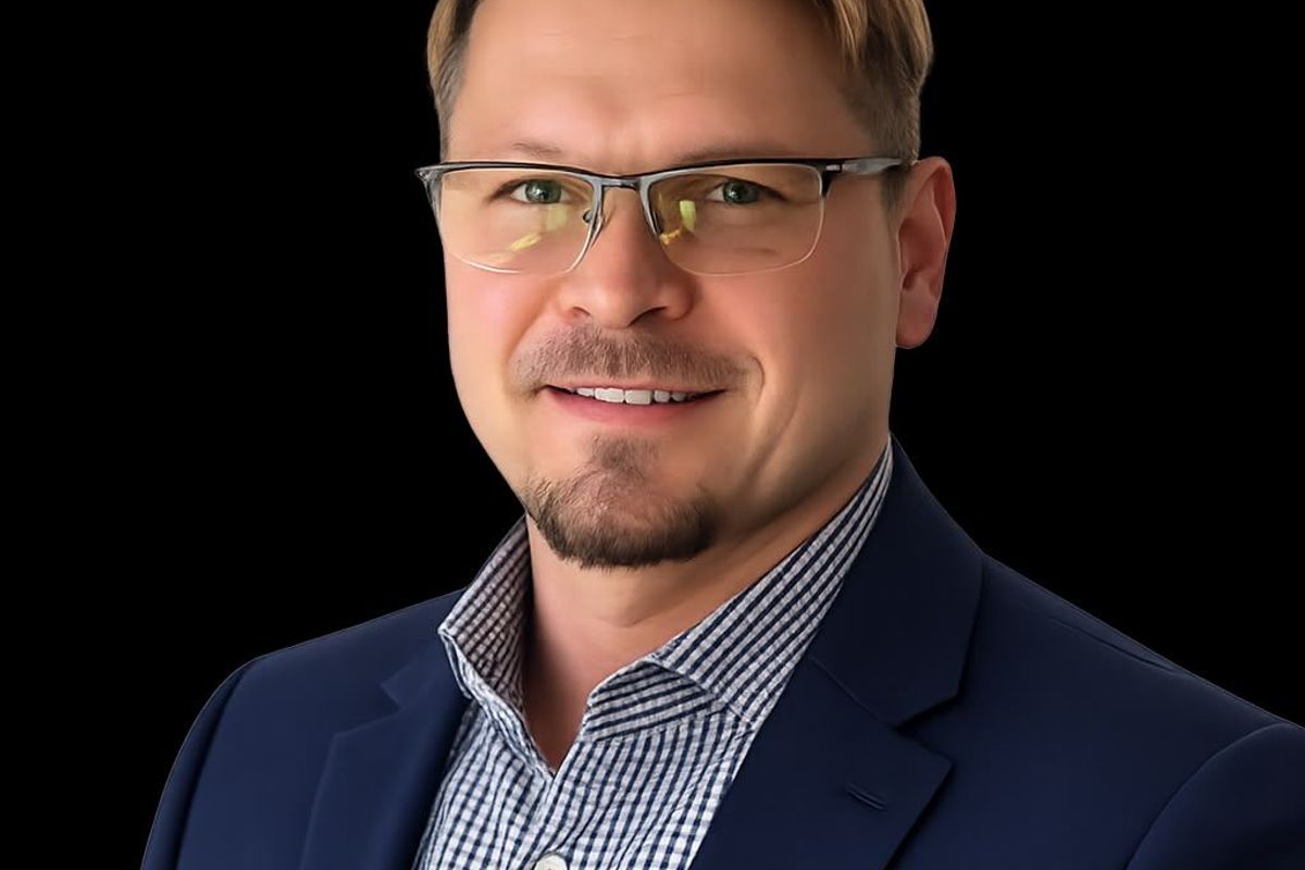 This image is a portrait of a person and does not contain any real estate or property information.