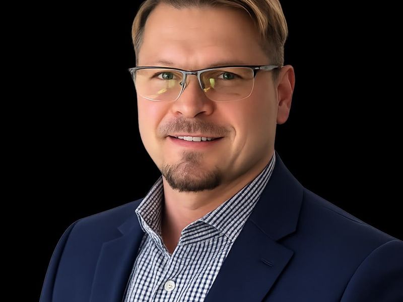 This image is a portrait of a person and does not contain any real estate or property information.