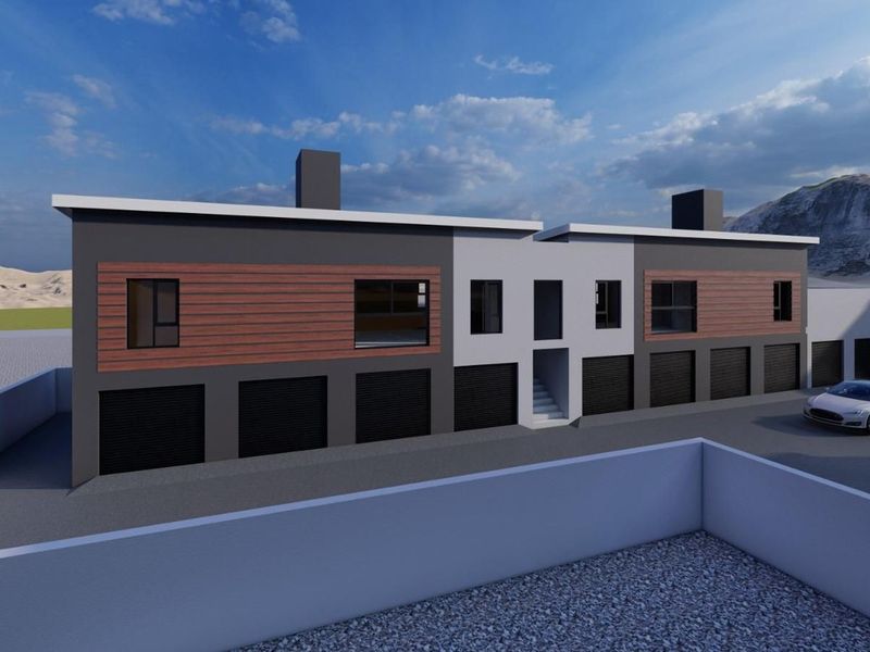 A modern architectural rendering of a multi-unit apartment building featuring multiple garage bays, contemporary cladding, and clean exterior lines.
