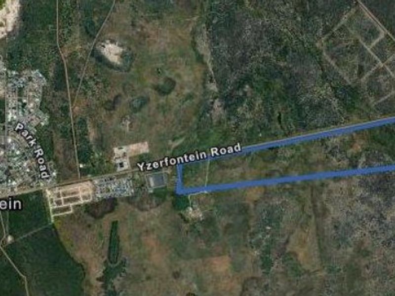 Aerial view of the vacant residential land parcel located near Yzerfontein Road, highlighting the property boundaries and surrounding landscape.