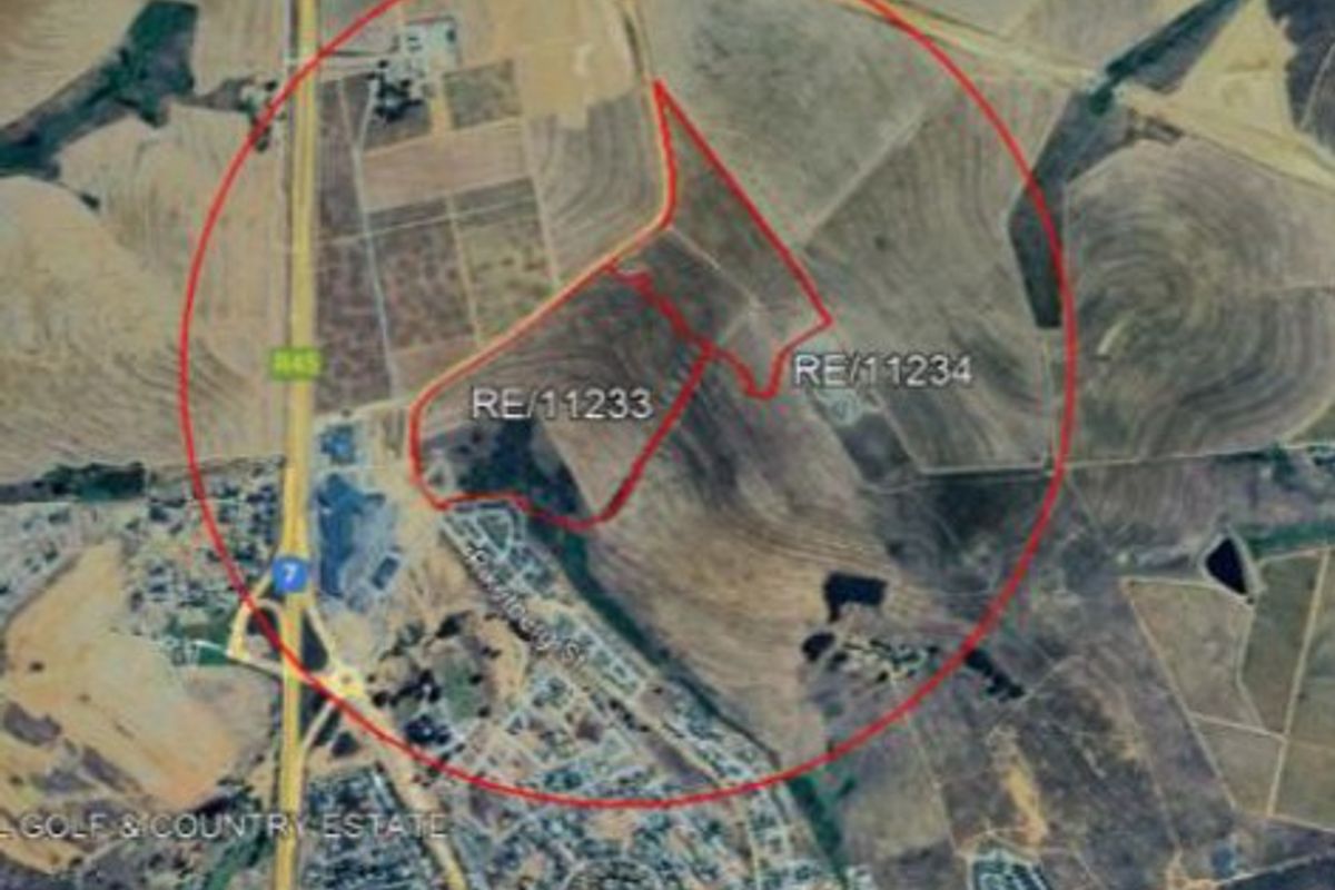 An aerial satellite view showing the land boundaries of properties RE/11233 and RE/11234 in relation to the surrounding area and road network.