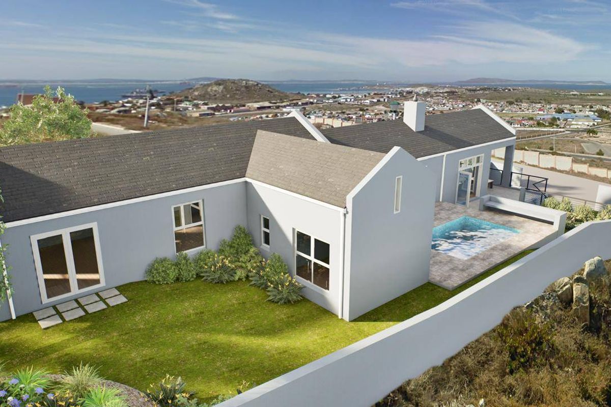 Aerial view of a residential property featuring a swimming pool, patio area, and landscaped garden with coastal views.
