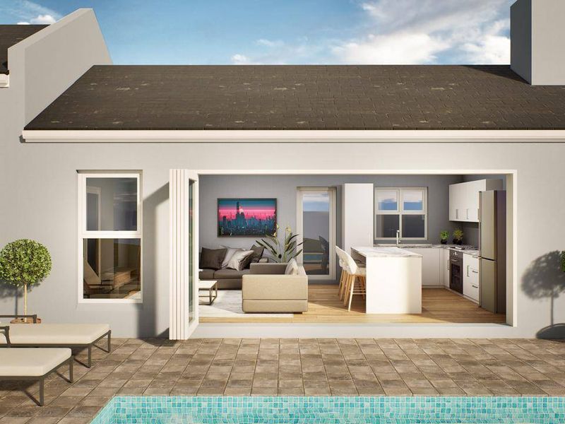 Rear view of the property featuring a tiled patio area, swimming pool, and seamless indoor-outdoor flow through large bi-fold doors.