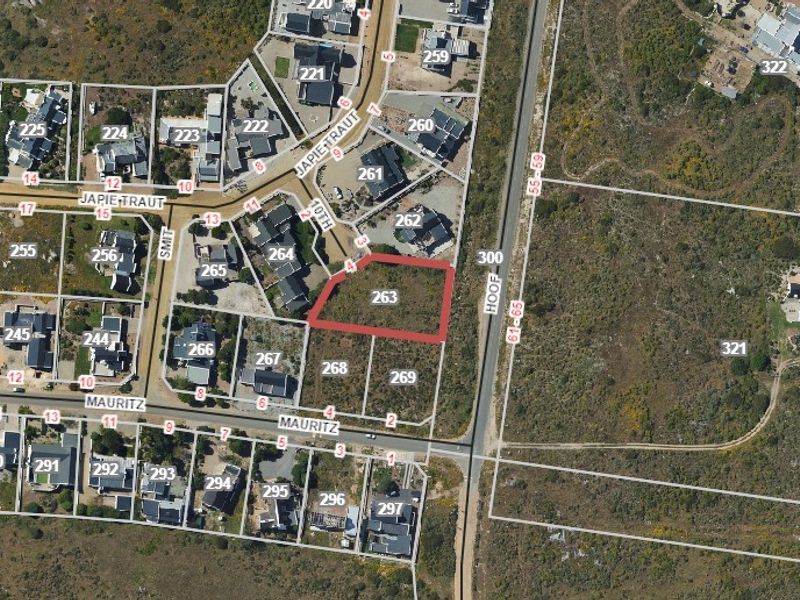 Aerial view of vacant residential plot 263, highlighting its location and boundaries within the established neighborhood.
