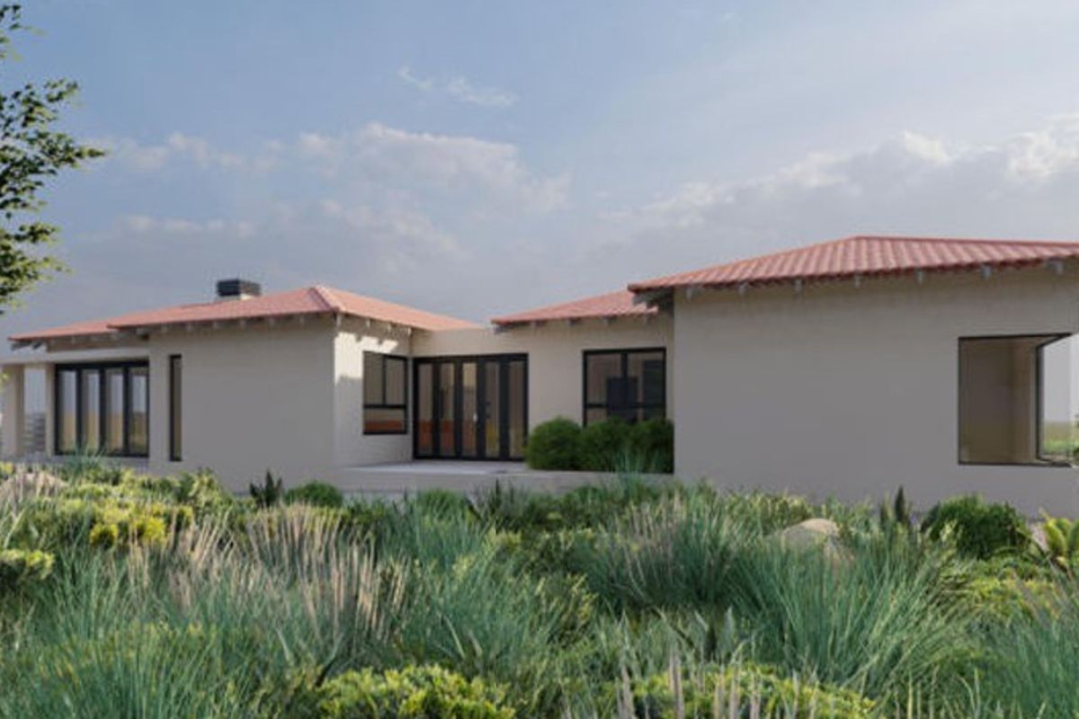 A modern single-story residence featuring a terracotta tiled roof, expansive glass sliding doors, and large windows, set within a landscaped garden environment.