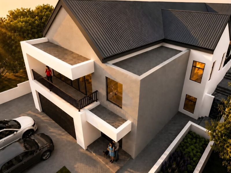 An elevated perspective of a modern two-story house featuring a dark metal roof, a spacious balcony, and a paved driveway.