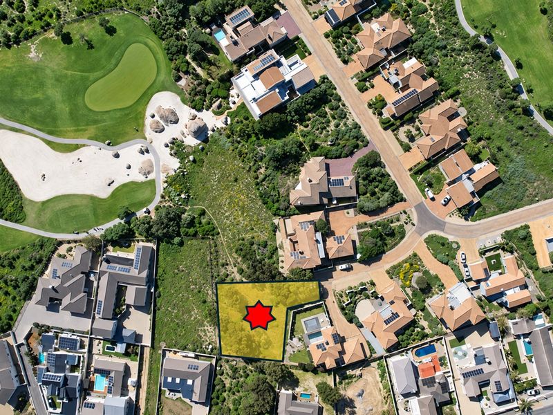 Aerial view of a vacant residential plot situated within a well-established golf estate, offering prime positioning for future development.